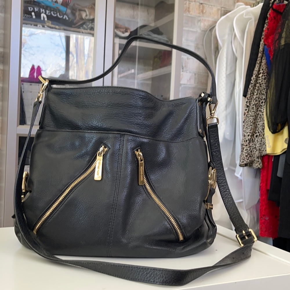 Black leather Michael Kors sack purse with shoulder & elbow strap